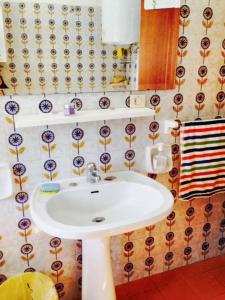 a bathroom with a white sink in a room at 2 bedrooms apartement at Porto Recanati 200 m away from the beach with furnished terrace in Porto Recanati