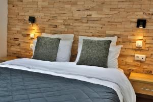 Ліжко або ліжка в номері Hotel L'ermitage