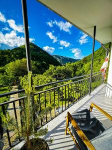 a balcony with a view of the mountains at Family hotel mountain panorama in Borjomi