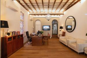 a living room with a couch and a table at Hotel Elite in Rome