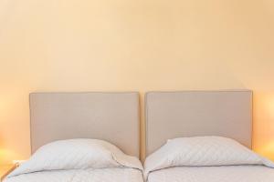 Posteľ alebo postele v izbe v ubytovaní Mariel House Fiskardo Kefalonia