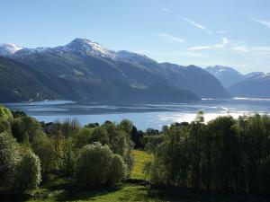 a view of a lake with mountains in the background at Villa Skoglund in Stranda