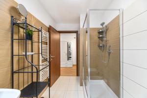 a bathroom with a shower and a sink at Clabucet Alpin Studio in Predeal +20 photos