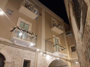 a building with two balconies with lights on them at B&B IL GROTTINO in Modugno