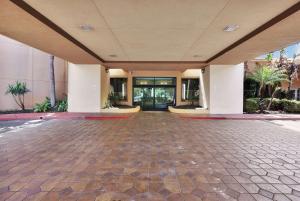 an empty lobby of a building with at Ramada by Wyndham Jacksonville I-95 by Butler Blvd in Jacksonville