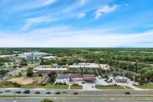 an aerial view of a hospital with a parking lot at Ramada by Wyndham Jacksonville I-95 by Butler Blvd in Jacksonville