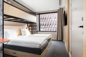 Postel nebo postele na pokoji v ubytování Heymo 1 by Sokos Hotels
