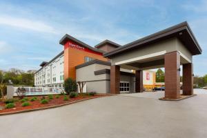 a building with a parking lot in front of it at La Quinta by Wyndham Knoxville Central Papermill in Knoxville