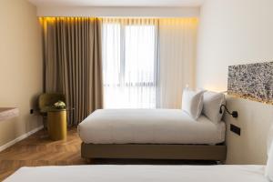 DIAGONAL HOTEL客房内的一张或多张床位