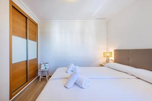 Postel nebo postele na pokoji v ubytování Jardines de Gorgos apartamento