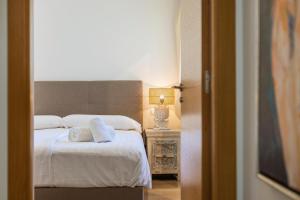 Postel nebo postele na pokoji v ubytování Jardines de Gorgos apartamento