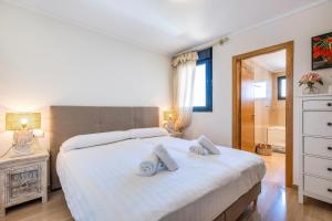 Postel nebo postele na pokoji v ubytování Jardines de Gorgos apartamento