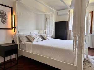 Postel nebo postele na pokoji v ubytování B&B RIO GRANDE
