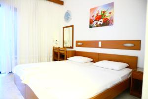 Postel nebo postele na pokoji v ubytování Danae Hotel