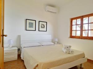 Ένα ή περισσότερα κρεβάτια σε δωμάτιο στο Villa Papiyon - Accesso privato alla spiaggia