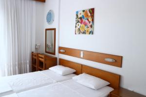 Postel nebo postele na pokoji v ubytování Danae Hotel