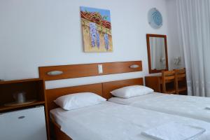 Postel nebo postele na pokoji v ubytování Danae Hotel