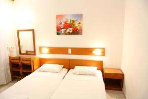 Postel nebo postele na pokoji v ubytování Danae Hotel