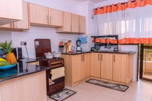 Kuchyň nebo kuchyňský kout v ubytování Havan Furnished Apartment-Shawmut