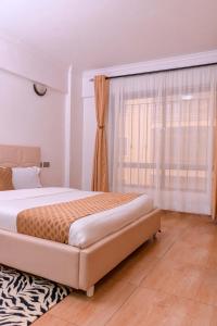 Postel nebo postele na pokoji v ubytování Havan Furnished Apartment-Shawmut