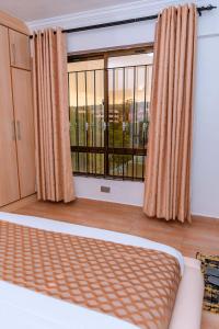 Postel nebo postele na pokoji v ubytování Havan Furnished Apartment-Shawmut