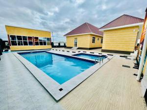 a swimming pool in front of a building at Dodoma Star Lounge in Dodoma