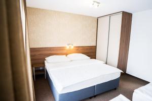 Postel nebo postele na pokoji v ubytování Apartmány Banff