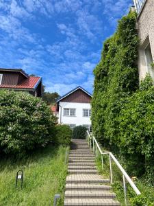 a stairway leading up to a white house at Nida Curonian Lagoon in Nida +6 photos