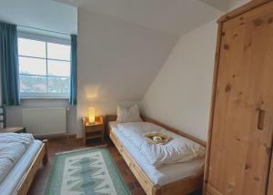 Postel nebo postele na pokoji v ubytování Resi H5 + 3 fotografie