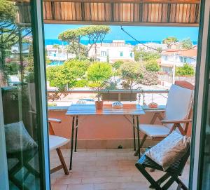 a table and chairs on a balcony with a view at Anzio paradise in Anzio