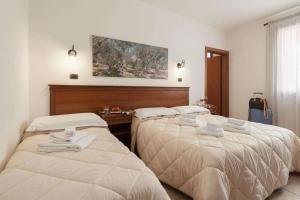 A bed or beds in a room at Relais Casina Copini