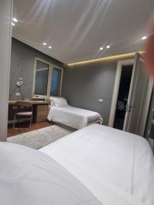 Postel nebo postele na pokoji v ubytování Ema Apartment Tirana