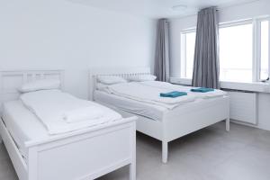 Ένα ή περισσότερα κρεβάτια σε δωμάτιο στο Summerday Guesthouse