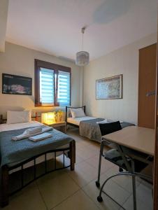 Posteľ alebo postele v izbe v ubytovaní New Sea & Sun House