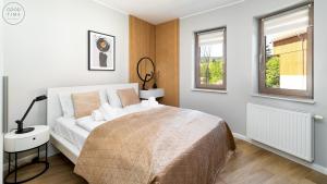 Posteľ alebo postele v izbe v ubytovaní Apartamenty Good Time- Stone Hill II