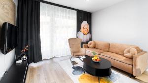 Televízia a/alebo spoločenská miestnosť v ubytovaní Apartamenty Good Time- Stone Hill II
