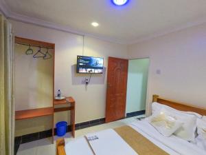 Mayas Suites客房内的一张或多张床位