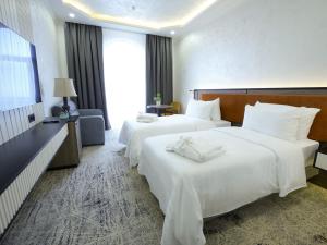 Postel nebo postele na pokoji v ubytování Eighty Eight Deluxe Hotel & Spa