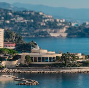 a large white building sitting on top of the water at 1 meter from Monaco. 5 min by elevators to Larvotto beach. in Beausoleil +10 photos