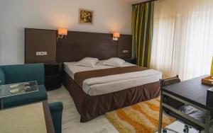 Ένα ή περισσότερα κρεβάτια σε δωμάτιο στο Hotel Dobsi