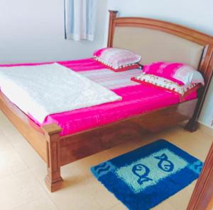 เตียงในห้องที่ Pazuri Coastal Escape