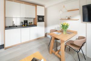 Кухня или мини-кухня в Nordstrandperle Ap H1
 +7 фотографий