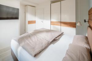 Кровать или кровати в номере Nordstrandperle Ap H1