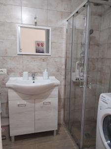 a bathroom with a sink and a shower at A Casa di Simo in Leverano +47 photos