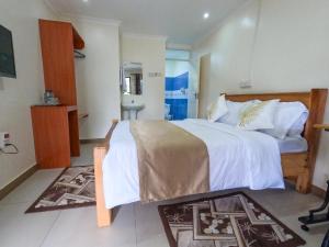 Mayas Suites客房内的一张或多张床位