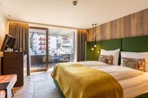 Hotel ZERMAMA Zermatt客房内的一张或多张床位