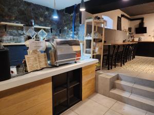 a restaurant with a counter with a toaster on it at Old Town Hostel Ohrid in Ohrid