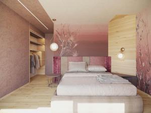 1 dormitorio con cama y pared de color rosa en Flos Hotel en Moena
