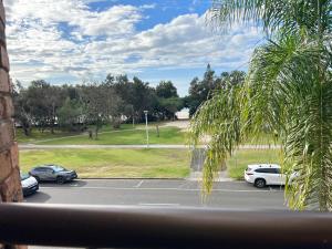 a view of a parking lot with cars parked at Pacific on Clarkes in Byron Bay