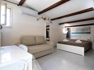 A bed or beds in a room at DUCEZIO rooms